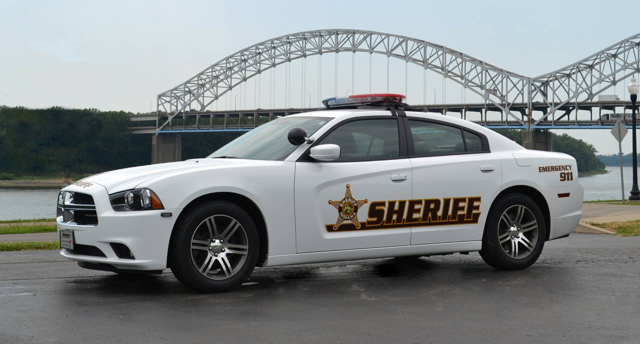 Sheriff Vehicle with bridge behind it.