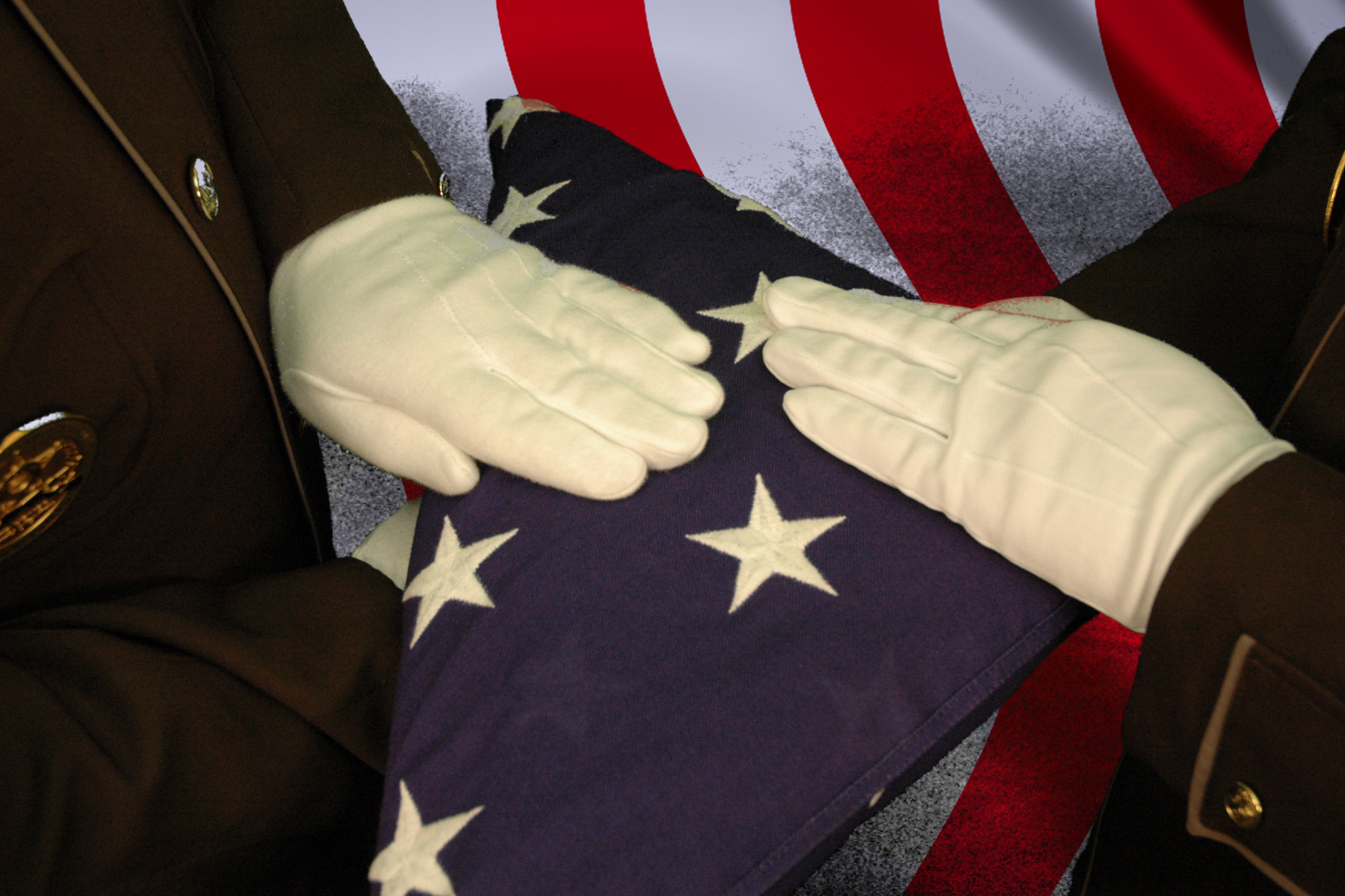 Folded flag with two officers hands